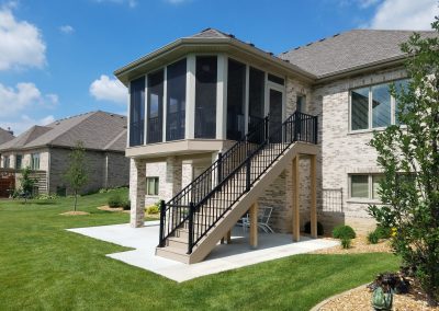 screened in room and stairway build over patio
