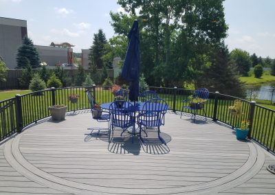 rounded composite deck with seating area