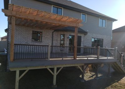 composite deck build with railing and custom pergola