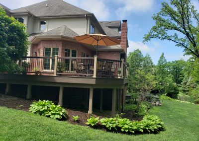 composite deck with two-tone railing and posts