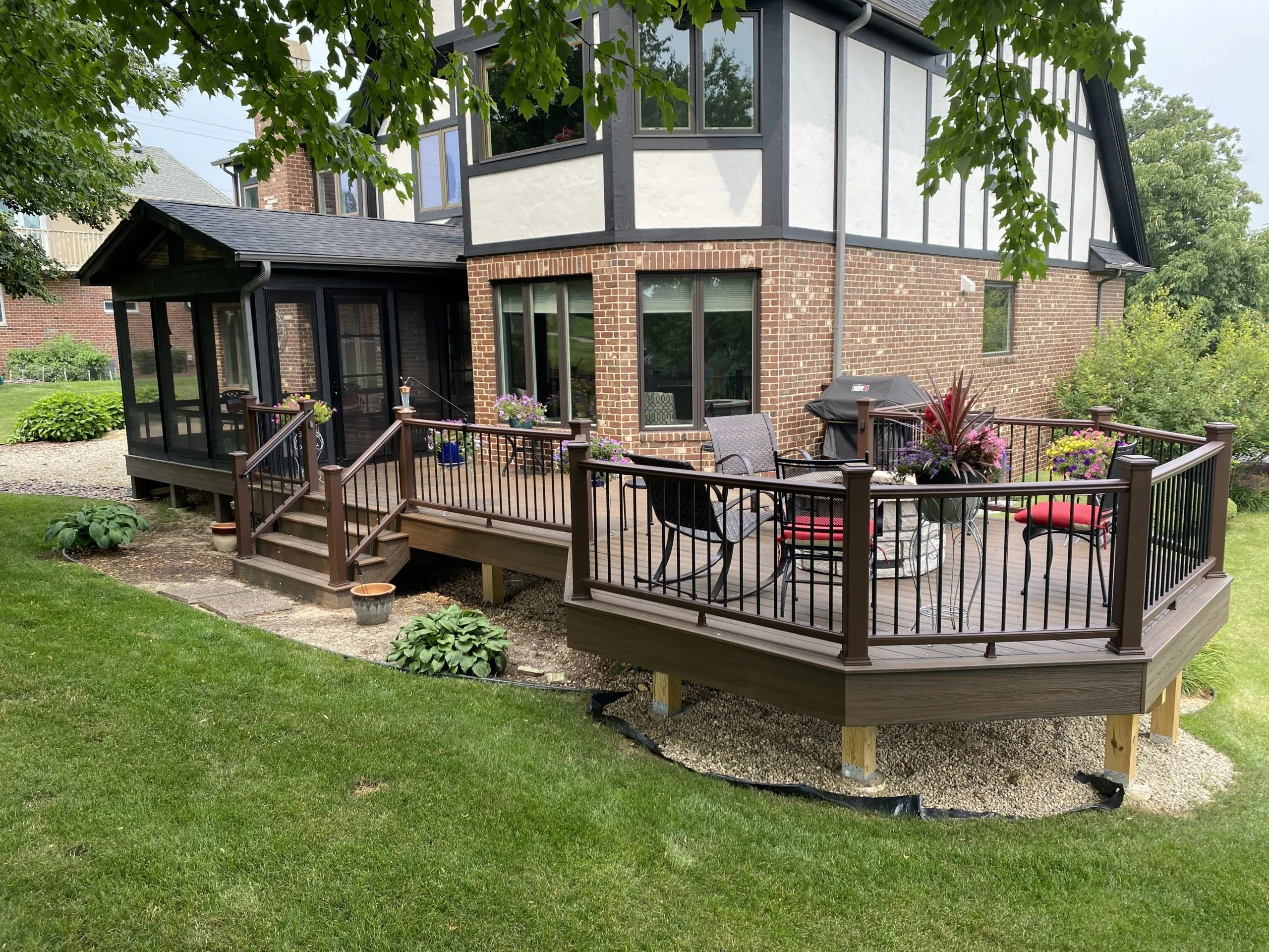 Custom Composite Deck with Built-In Fire Pit and Screened-In Room
