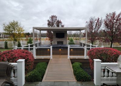 covered composite deck with outdoor fireplace