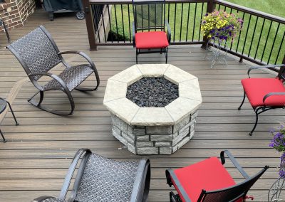 custom composite deck with built-in firepit and seating area
