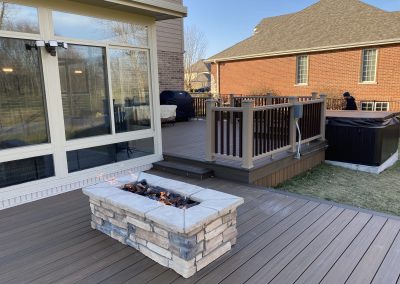 multi-level composite deck designed for entertaining with built-in firepit