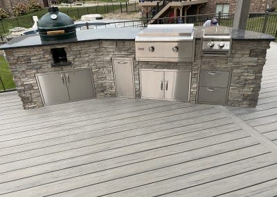 stone outdoor kitchen on composite deck