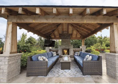 pavilion with outdoor fireplace over patio