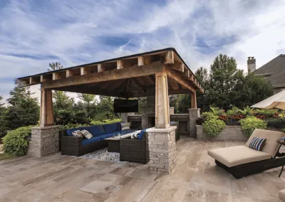 pavilion build with outdoor fireplace over patio