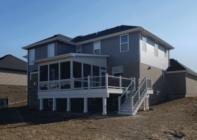 screened in room and composite deck build with stairway