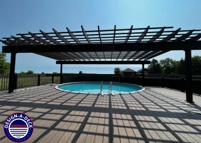 large pergola and composite deck around above ground pool